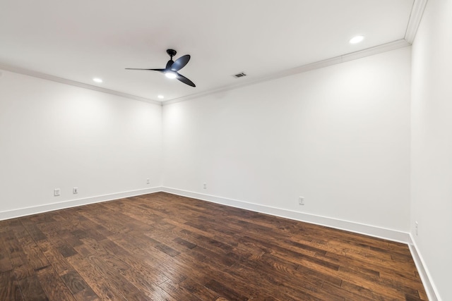 spare room with crown molding, dark wood-type flooring, and ceiling fan