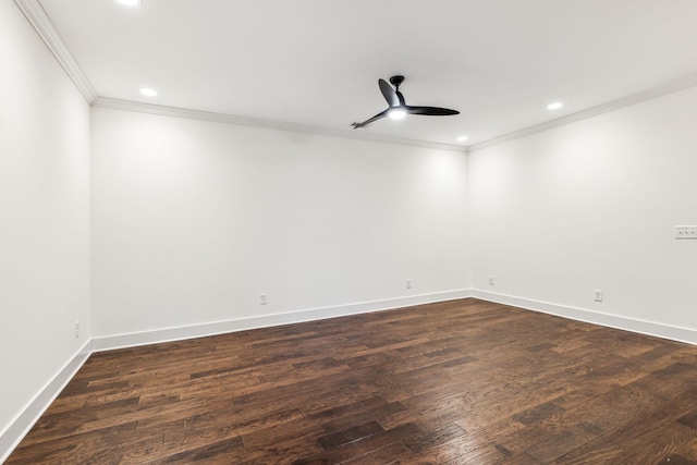 spare room featuring dark wood-type flooring, ceiling fan, and ornamental molding