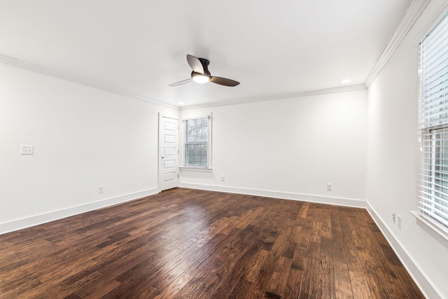 spare room with crown molding, dark hardwood / wood-style floors, and ceiling fan