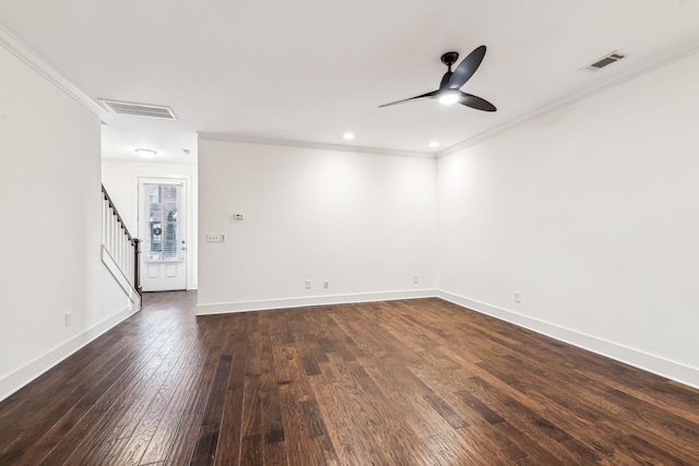 spare room featuring ornamental molding, dark hardwood / wood-style floors, and ceiling fan