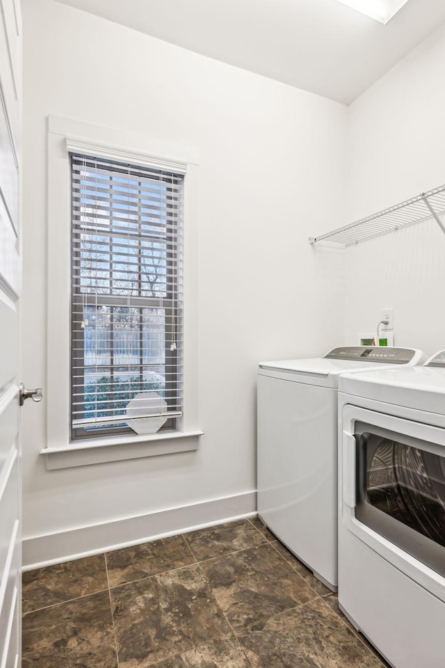 laundry room featuring separate washer and dryer