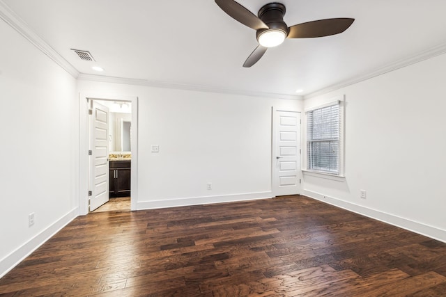 unfurnished bedroom featuring connected bathroom, crown molding, dark hardwood / wood-style floors, and ceiling fan