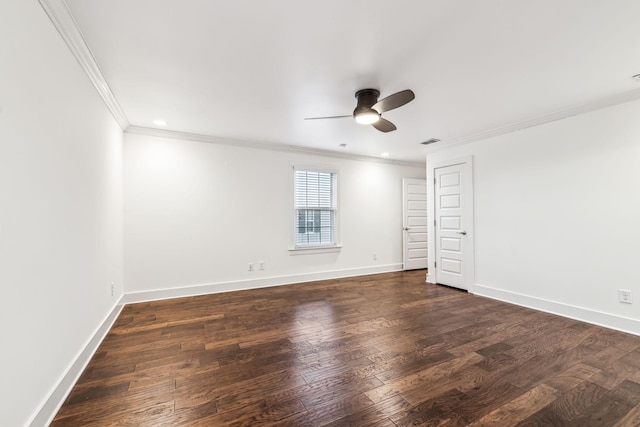 spare room featuring ornamental molding, dark wood-type flooring, and ceiling fan