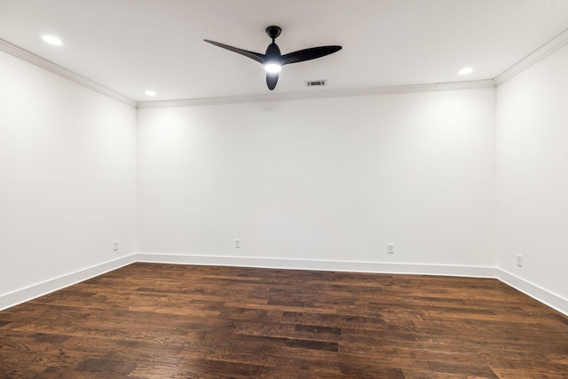 spare room featuring dark wood-type flooring, ceiling fan, and ornamental molding