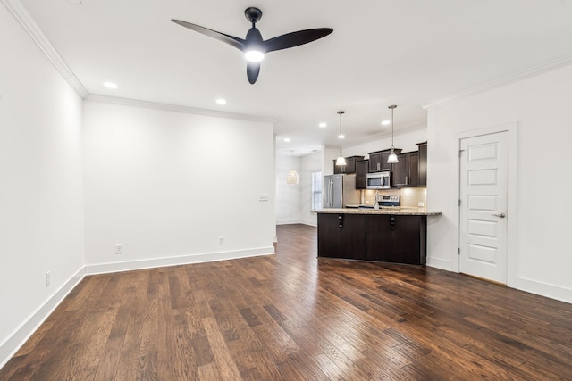 kitchen featuring pendant lighting, dark wood-type flooring, a breakfast bar, stainless steel appliances, and kitchen peninsula