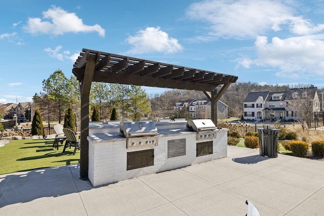 view of patio featuring area for grilling, a grill, and a pergola