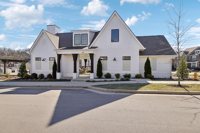 modern farmhouse style home featuring a porch