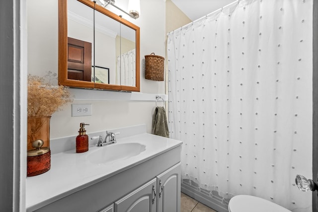 bathroom featuring vanity, toilet, and tile patterned flooring