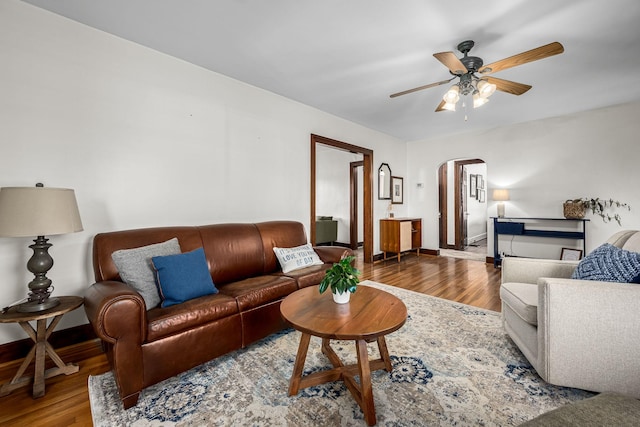 living room with hardwood / wood-style floors and ceiling fan