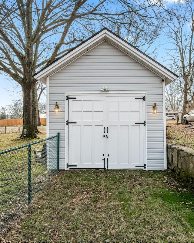 view of outbuilding with a yard