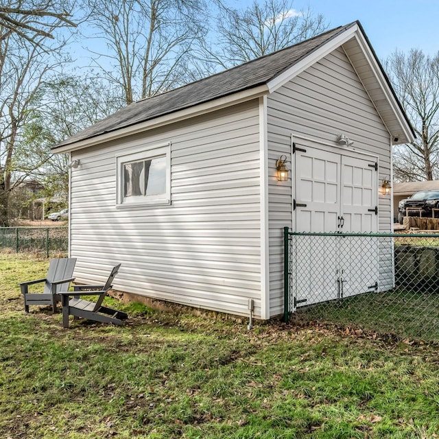 view of outbuilding with a lawn