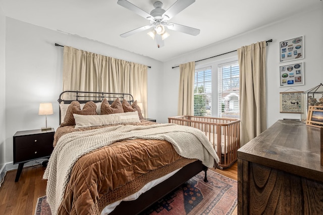 bedroom featuring wood-type flooring and ceiling fan