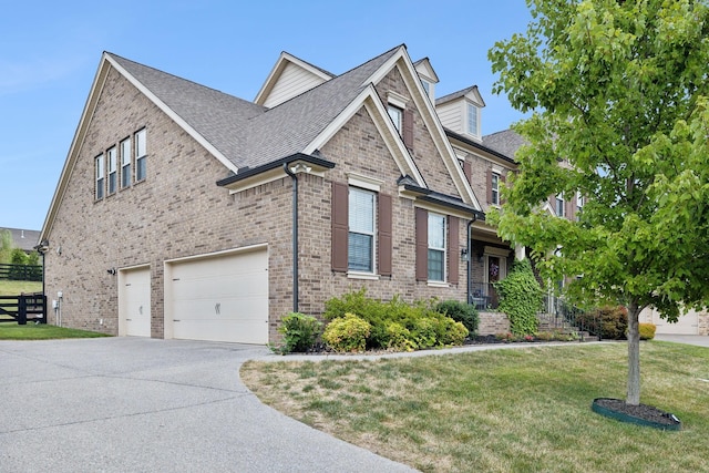 view of home's exterior featuring a garage and a lawn