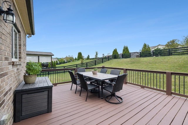 wooden deck with a lawn