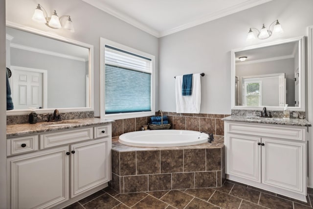 bathroom featuring ornamental molding, tiled bath, and vanity