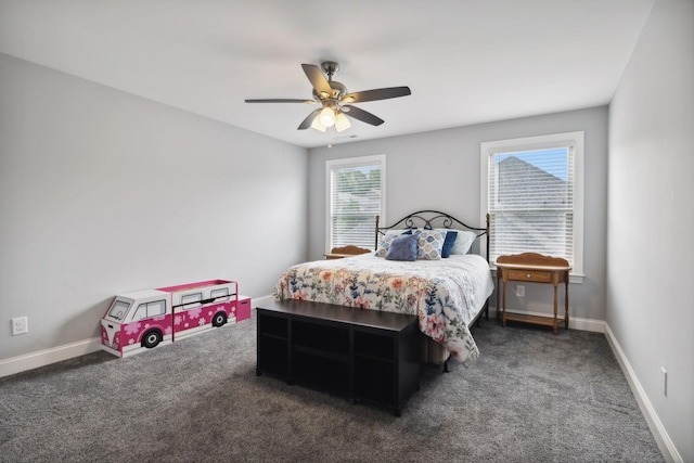 bedroom with dark colored carpet and ceiling fan