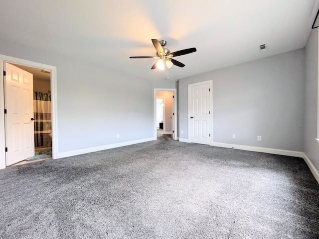 unfurnished bedroom with ceiling fan, ensuite bathroom, and carpet floors