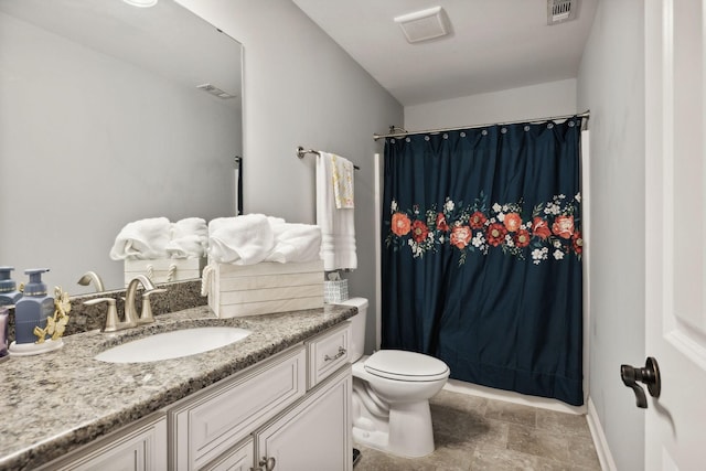 bathroom featuring vanity, a shower with curtain, and toilet