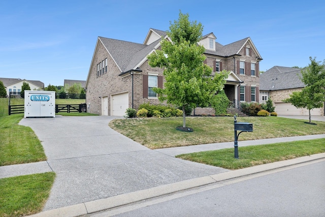 view of front of house featuring a garage and a front yard