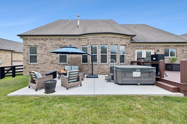 back of house featuring a wooden deck, an outdoor living space, a hot tub, and a yard