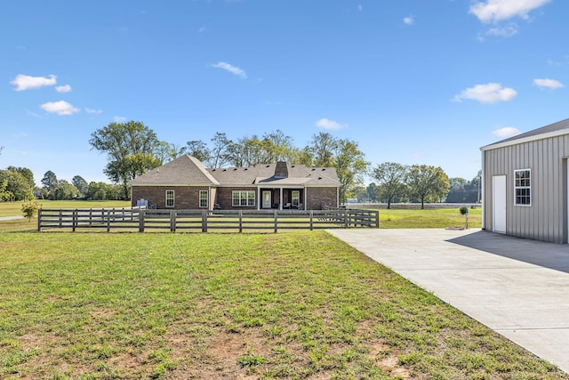 view of yard with a rural view