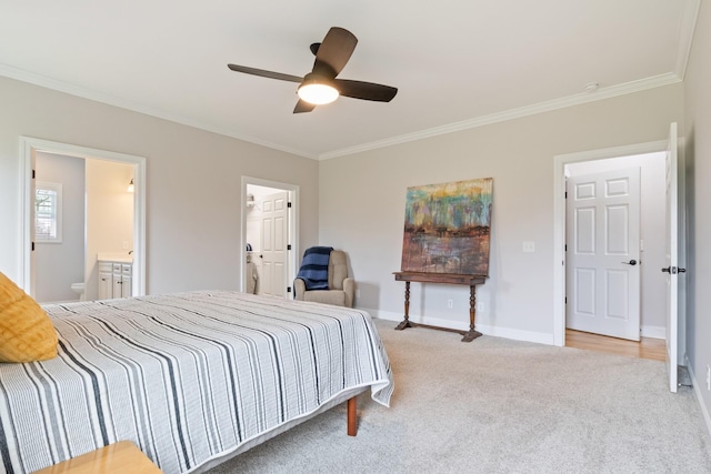 carpeted bedroom with crown molding, ceiling fan, and ensuite bathroom