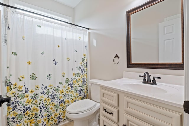 bathroom with vanity, toilet, and a shower with shower curtain