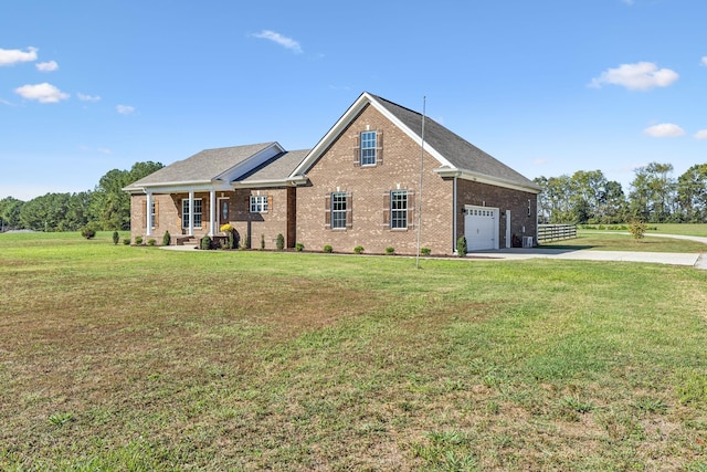 view of front of house featuring a garage and a front lawn