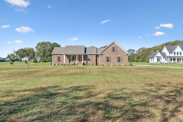 view of front of property with a porch and a front yard