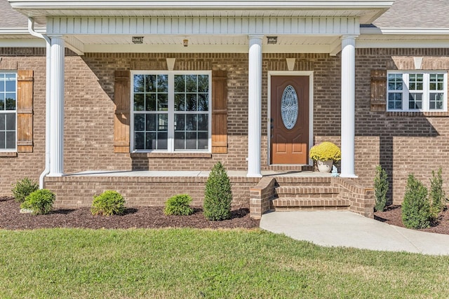 property entrance featuring a porch