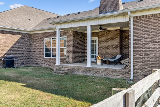 rear view of house featuring a lawn, a patio, and ceiling fan