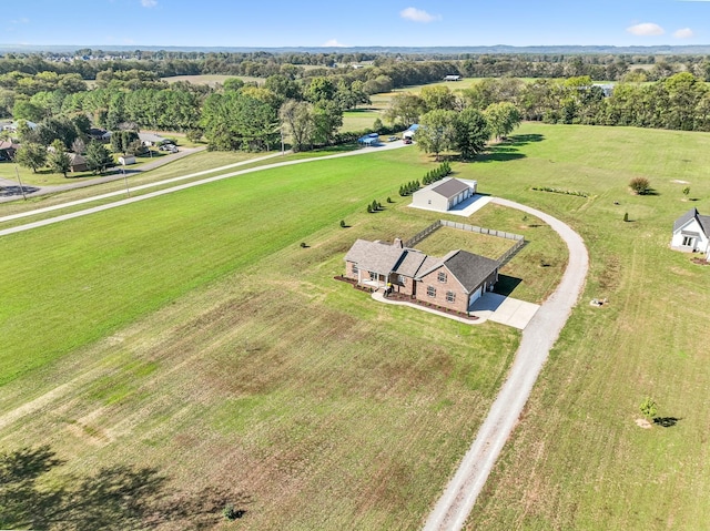 birds eye view of property with a rural view