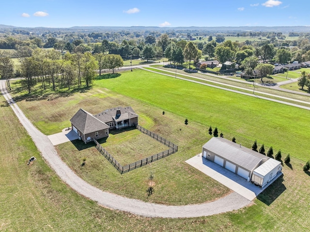 birds eye view of property with a rural view