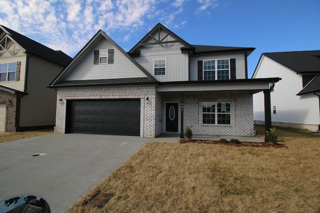 view of front facade featuring a garage, a front yard, and a porch