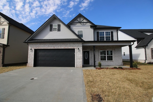 view of front of property featuring a garage and a front lawn