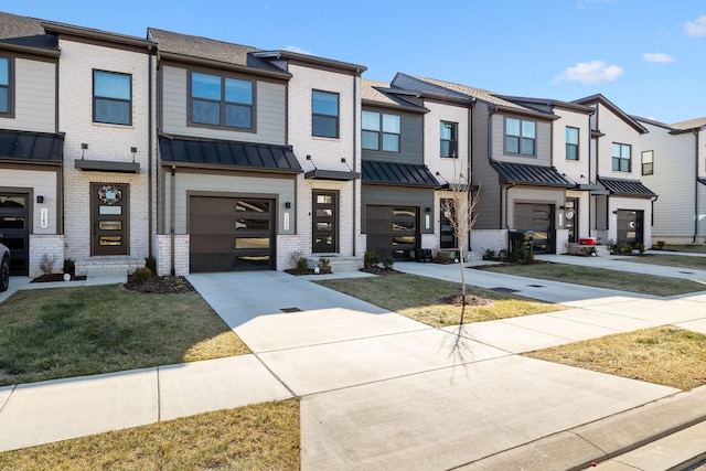 view of property featuring a garage and a front yard