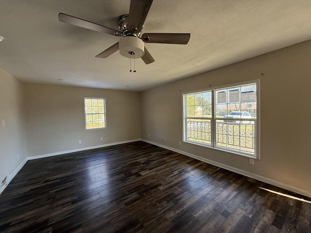 unfurnished room featuring ceiling fan, dark hardwood / wood-style floors, and a textured ceiling