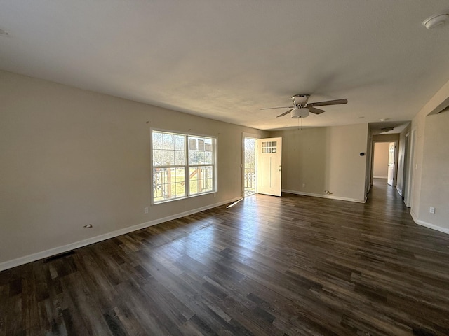 unfurnished room featuring dark hardwood / wood-style floors and ceiling fan