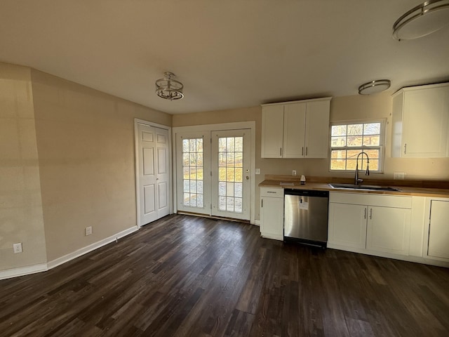 kitchen with white cabinetry, dishwasher, sink, and dark hardwood / wood-style flooring