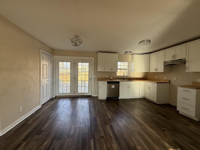 kitchen featuring white cabinets, dark hardwood / wood-style floors, and dishwasher