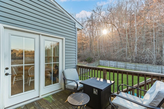 wooden deck featuring a yard