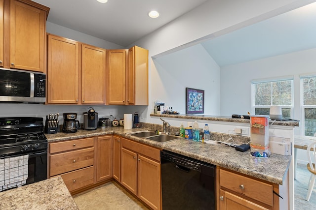 kitchen featuring kitchen peninsula, sink, and black appliances