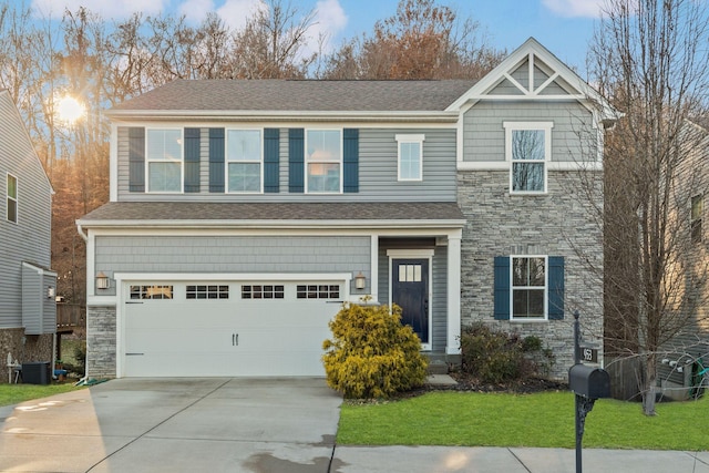 view of front of home featuring a garage, a front lawn, and central air condition unit