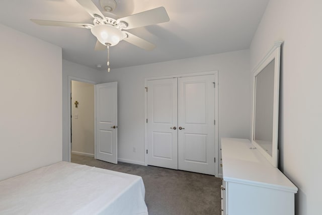 carpeted bedroom featuring a closet and ceiling fan