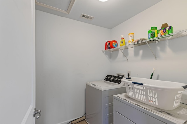 laundry room featuring independent washer and dryer