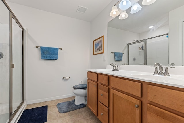 bathroom featuring vanity, toilet, and walk in shower