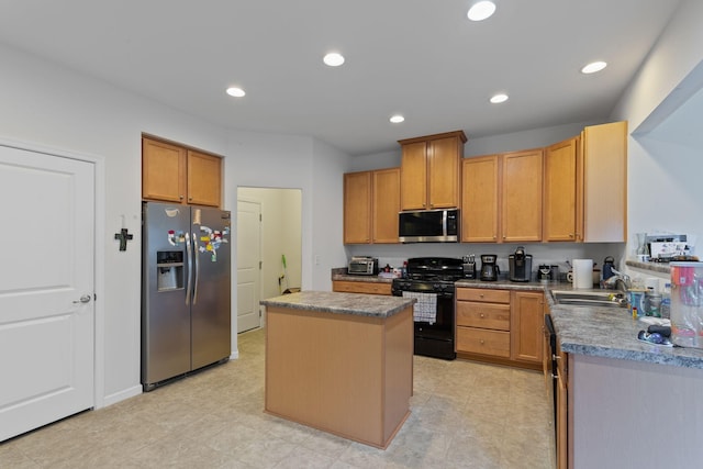 kitchen featuring a center island, sink, and black appliances