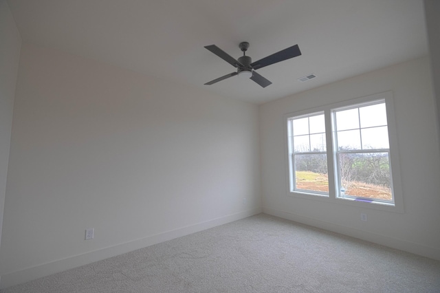 carpeted empty room with ceiling fan