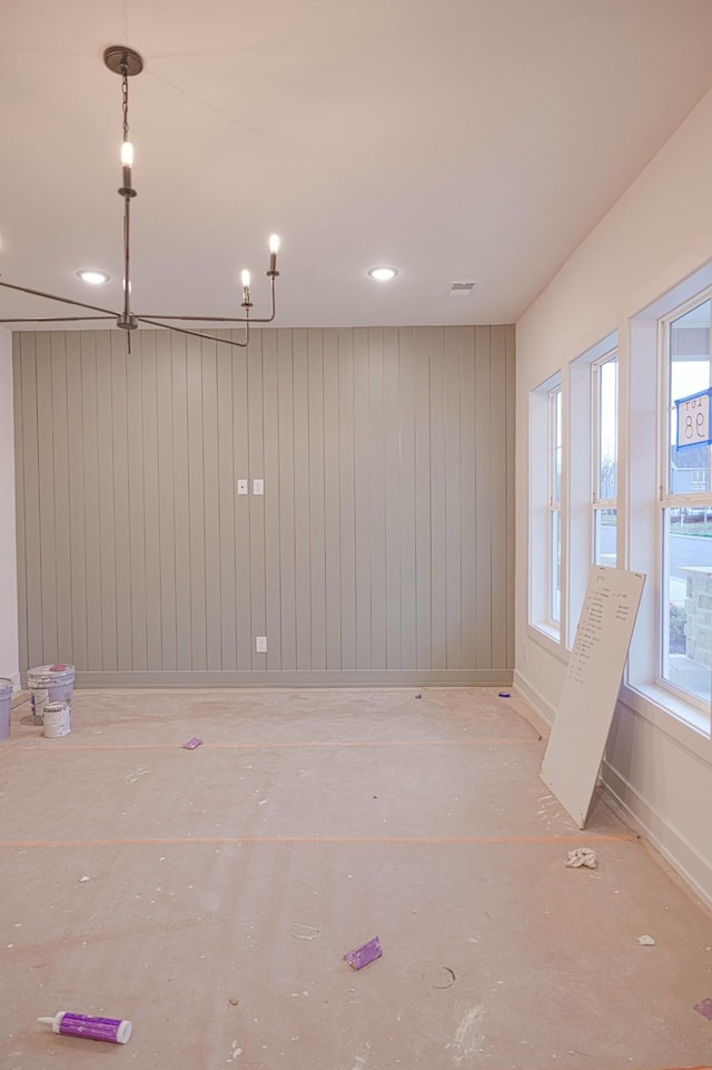 empty room featuring concrete floors, recessed lighting, visible vents, and baseboards