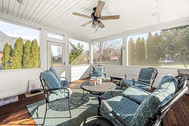 sunroom / solarium with wood ceiling and ceiling fan